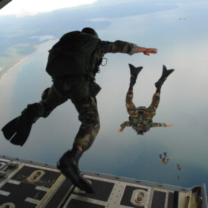 U.S. Air Force Airmen from the 720th Special Tactics Group out of Hurlburt Field, Fla., jump out of a C-130J Hercules aircraft during water rescue training over the Destin coastline in Florida Oct. 3, 2007. The training is designed to enhance aerial zodiac deployment and personnel recovery. The aircraft belongs to the 41st Airlift Squadron out of Little Rock Air Force Base in Arkansas. DoD photo by Senior Airman Julianne Showalter, U.S. Air Force. (Released)